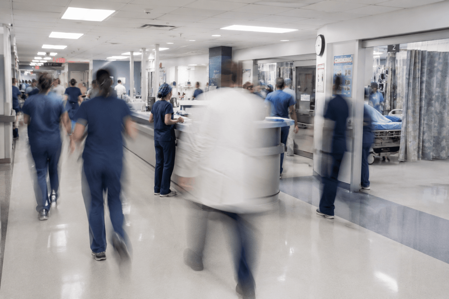 blurred over-exposure image of busy hospital interior